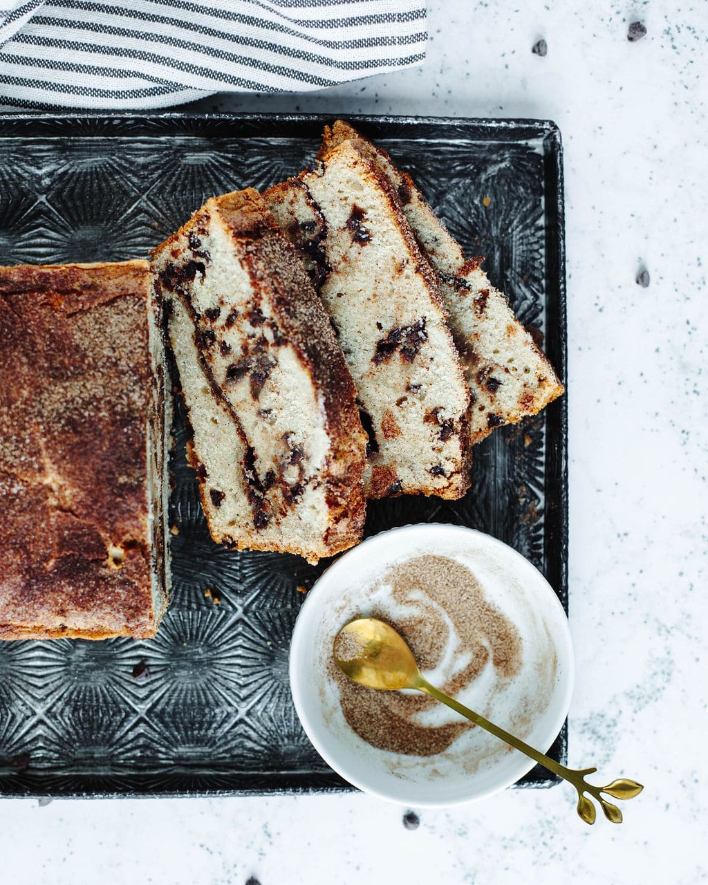 Homemade snickerdoodle loaf with mini chocolate chips and crispy cinnamon crust