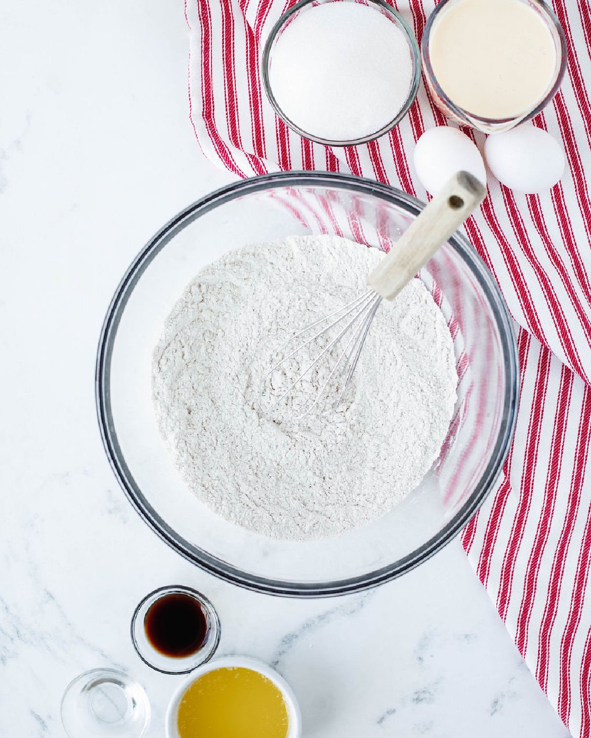 dry ingredients combined in a glass mixing bowl.