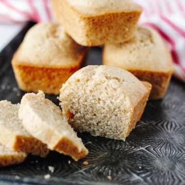 Slices of Eggnog Mini Loaf showing moist, spiced interior with hints of cinnamon and nutmeg.