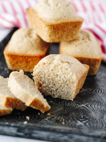 Slices of Eggnog Mini Loaf showing moist, spiced interior with hints of cinnamon and nutmeg.