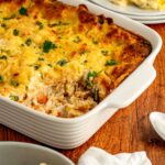 easy chicken cobbler baked in a white casserole pan ready to serve.
