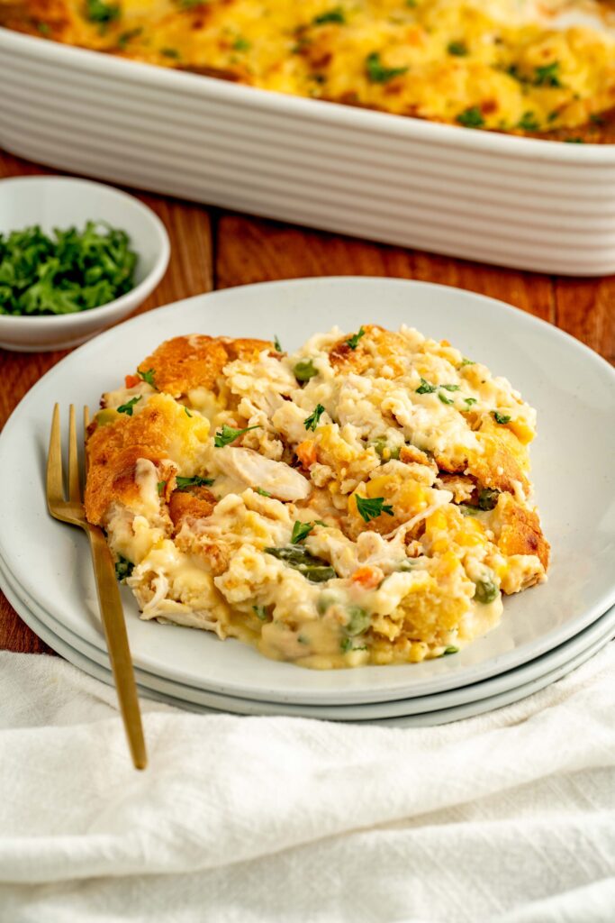 a hearty chicken casserole with biscuits, chicken, and veggies