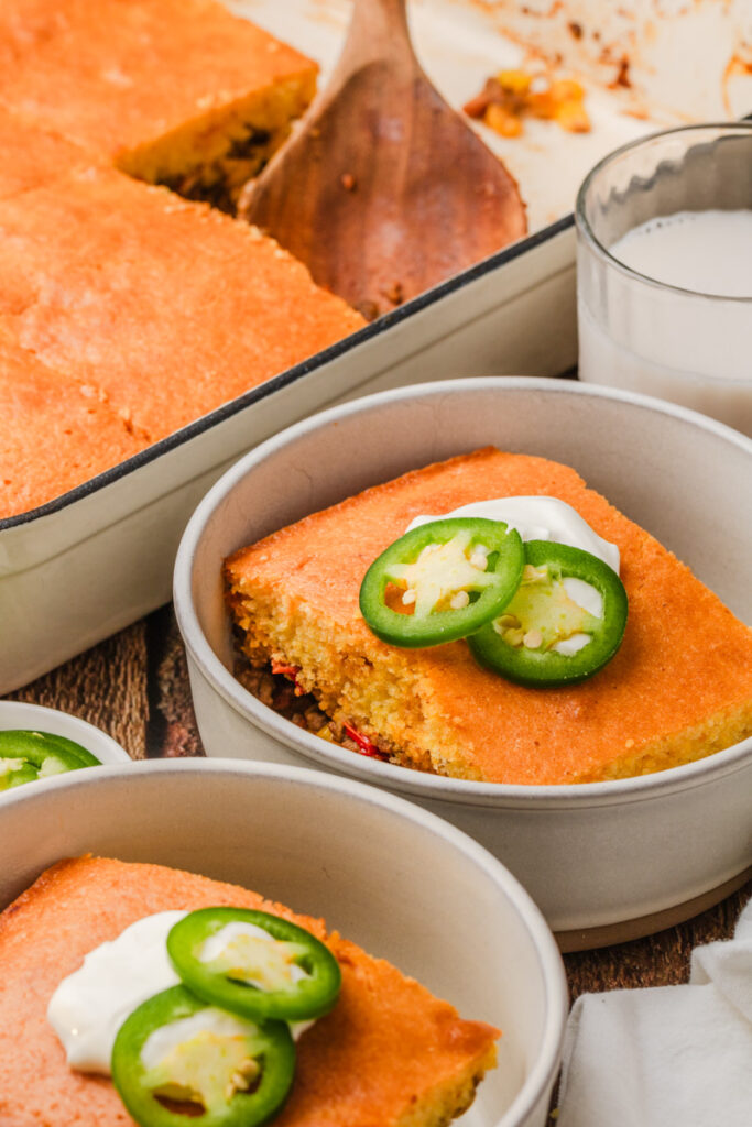 diced jalapenos on top of cornbread cowboy casserole.