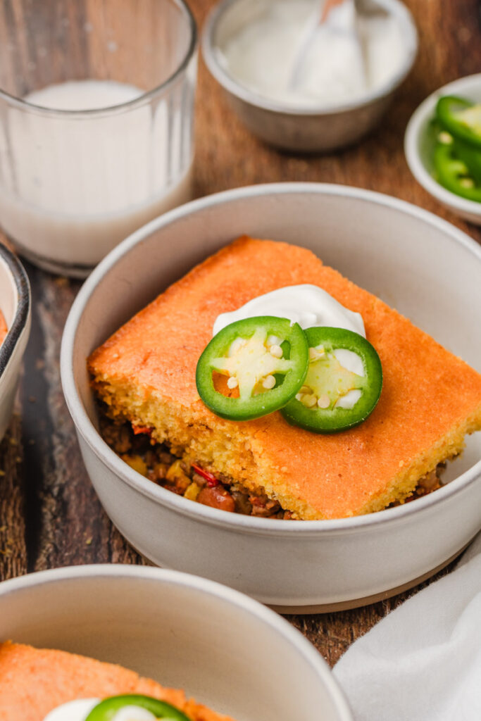 a serving of jiffy cornbread casserole in a bowl.