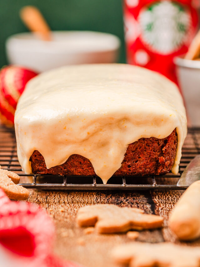 cream cheese frosting coating gingerbread loaf.