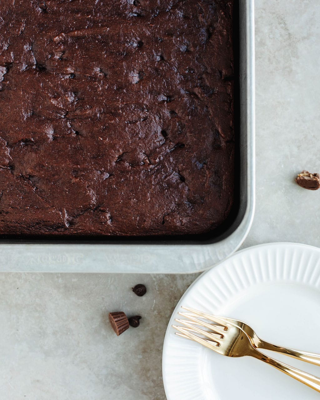 Death by Chocolate Peanut Butter Dump Cake fresh out of the oven in a greased 9x13 pan, gooey and fudgy.