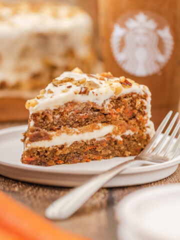 a slice of carrot cake served on a plate.