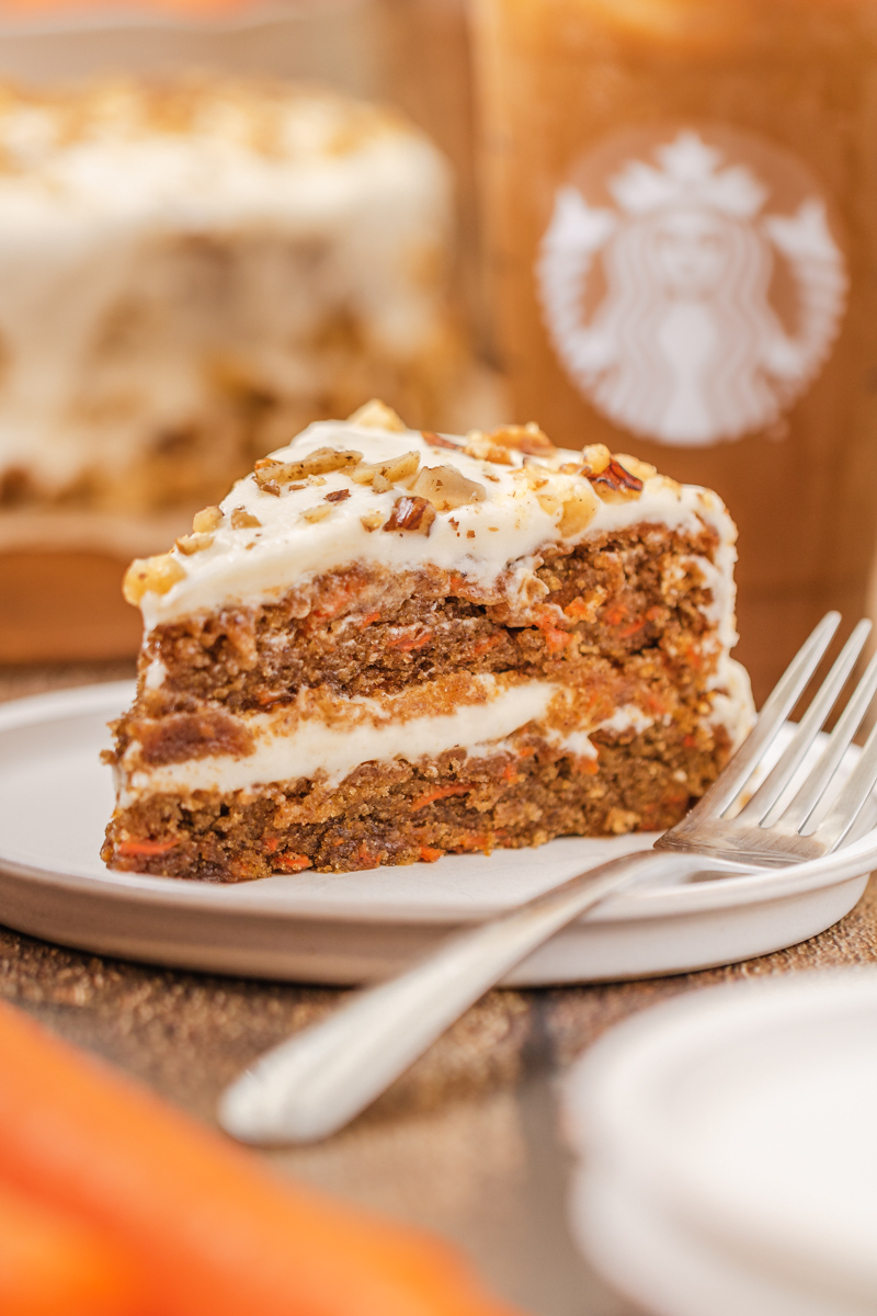 a slice of carrot cake on a plate.