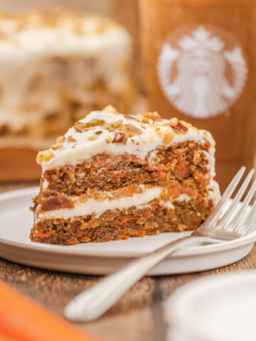 a slice of carrot cake served on a plate.