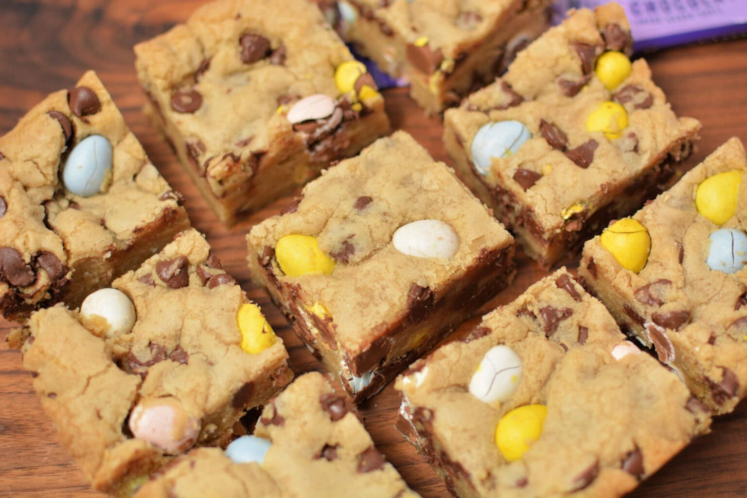 Pieces of blondies with Cadbury mini eggs throughout.