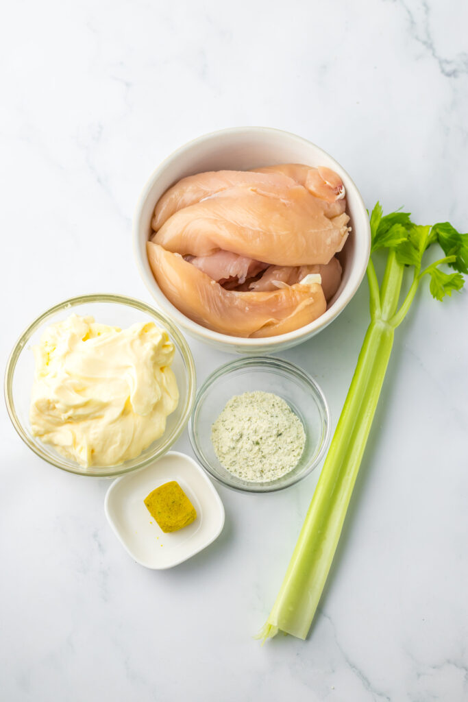 all the ingredients needed to make classic chicken salad sandwiches.