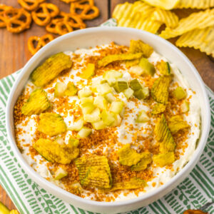 pretzels and chips served with pickle sauce dip.