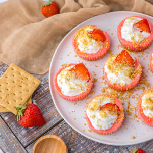 bite sized cheesecakes on a serving plate ready to serve.