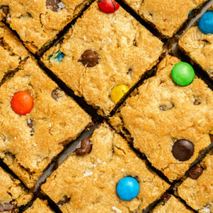 a batch of cookie dough made into thick cookie bars and ready to serve.