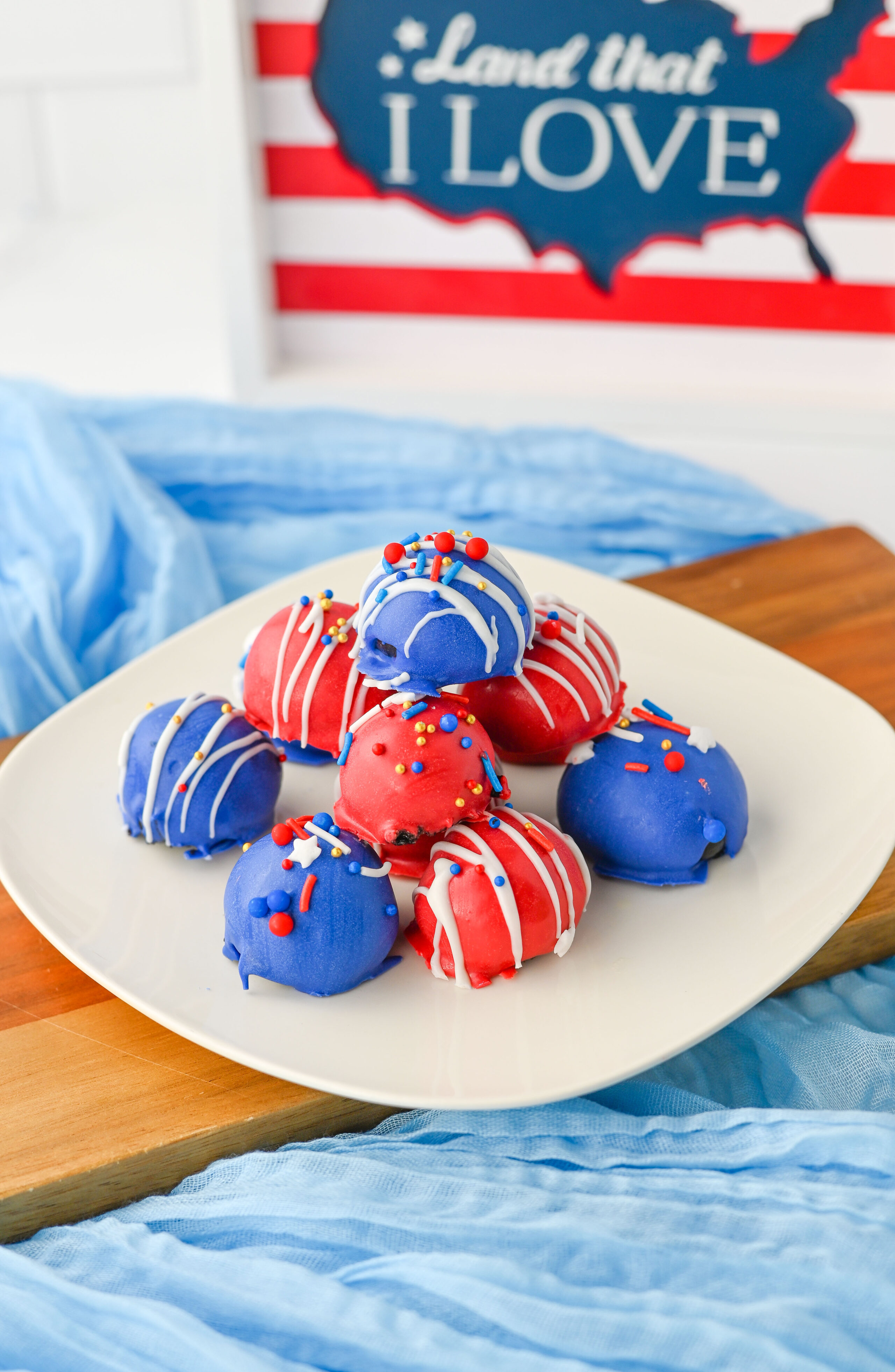 no bake Oreo truffles on a plate colored red, white, and blue.