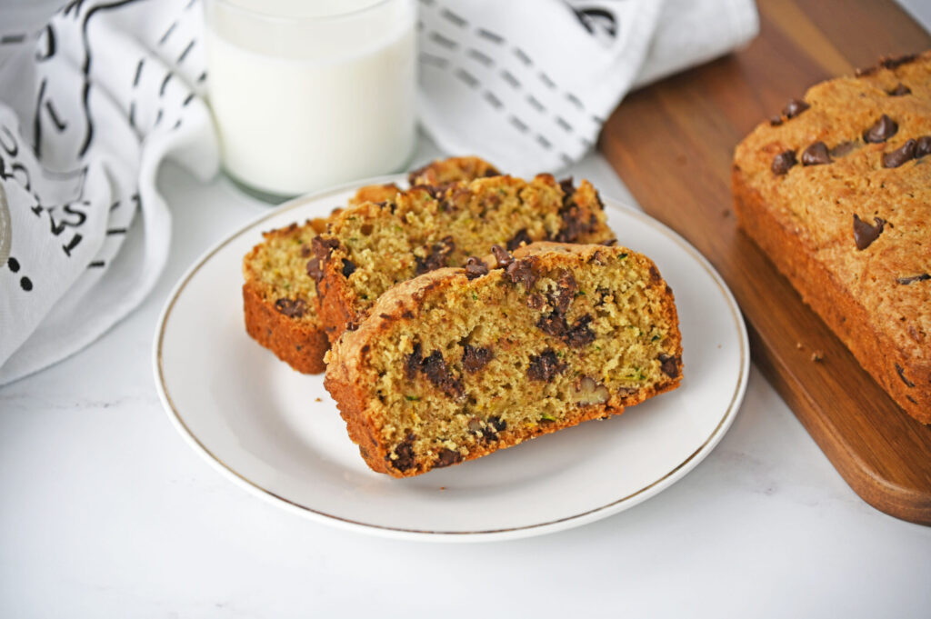 slices of zucchini loaf on a white plate.