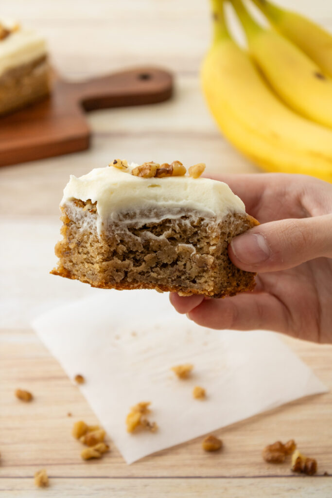 a banana bread bar with a bite taken out of it.