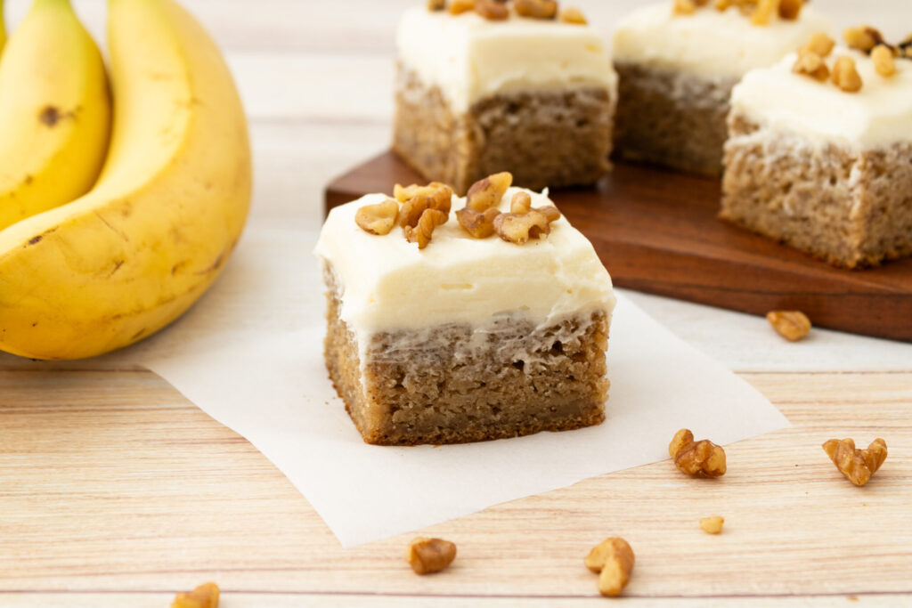cut pieces of cake flavored with banana and frosting.