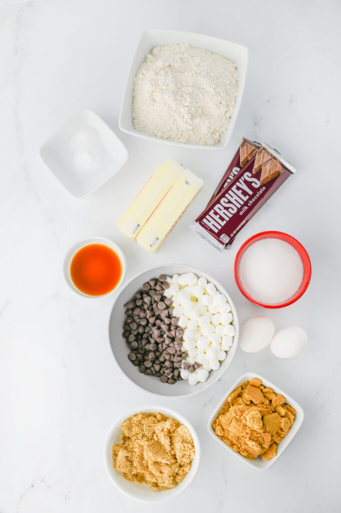 all the ingredients needed to make s'mores cookies from scratch,