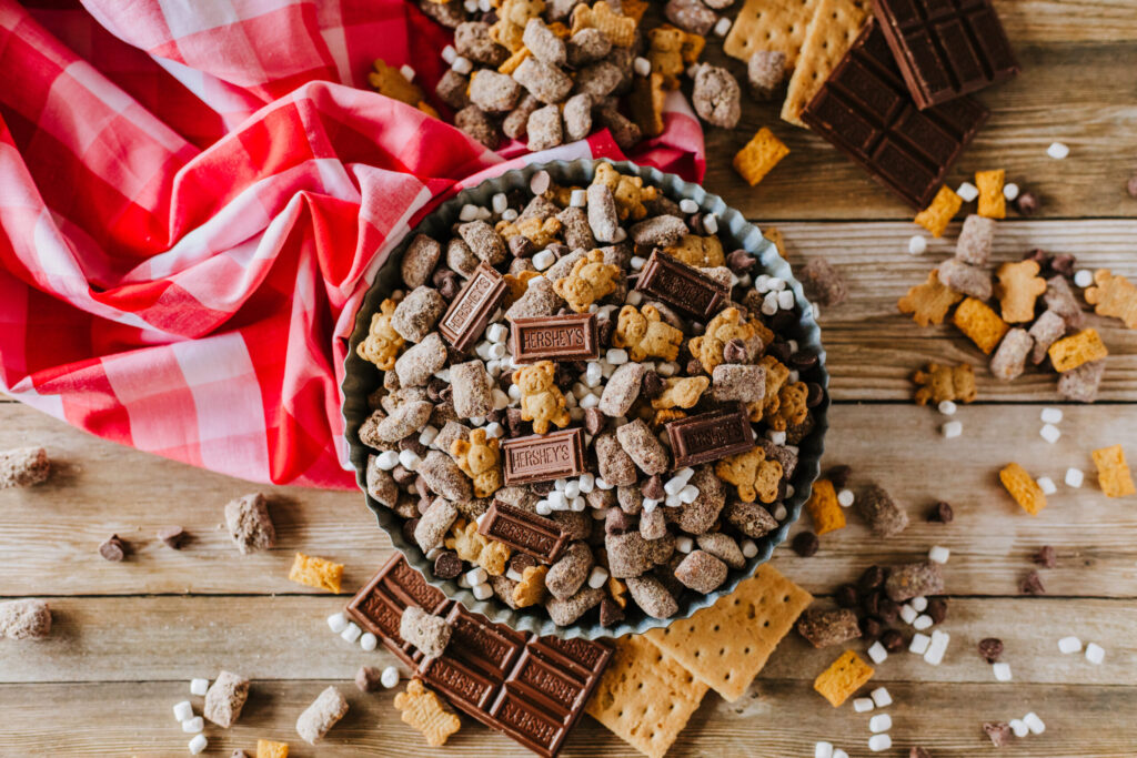 a chocolate graham cracker snack mix with marshmallows, teddy grahams, and Hershey bars.
