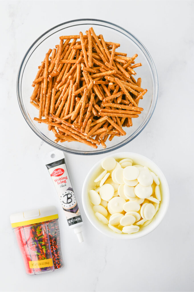 all the ingredients needed to make Halloween pretzel webs.
