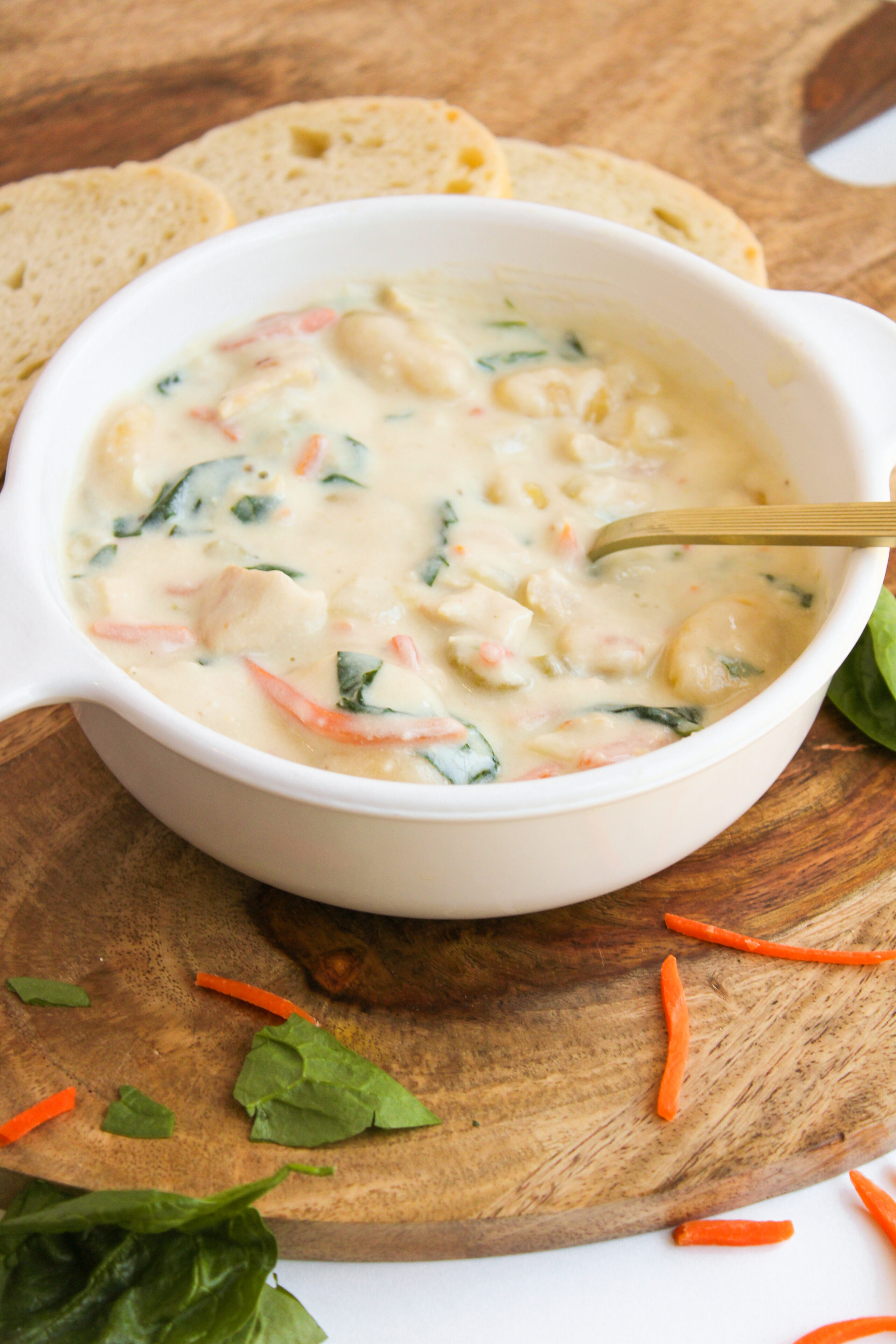 creamy chicken and gnocchi soup in a white bowl.