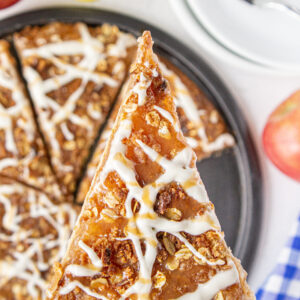 a slice of apple dessert pizza being served.