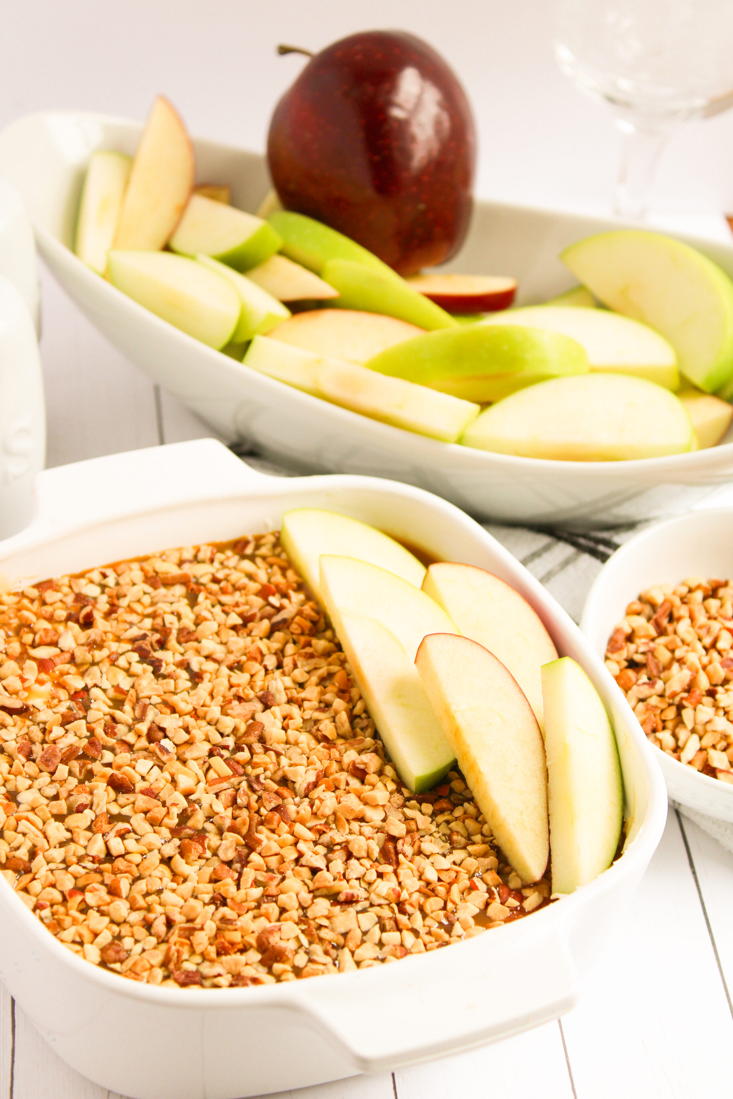 cream cheese caramel apple dip in a white dish.