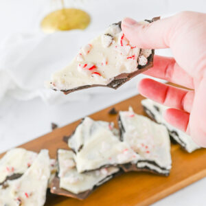 a piece of candy candy Oreo Bark being picked up.