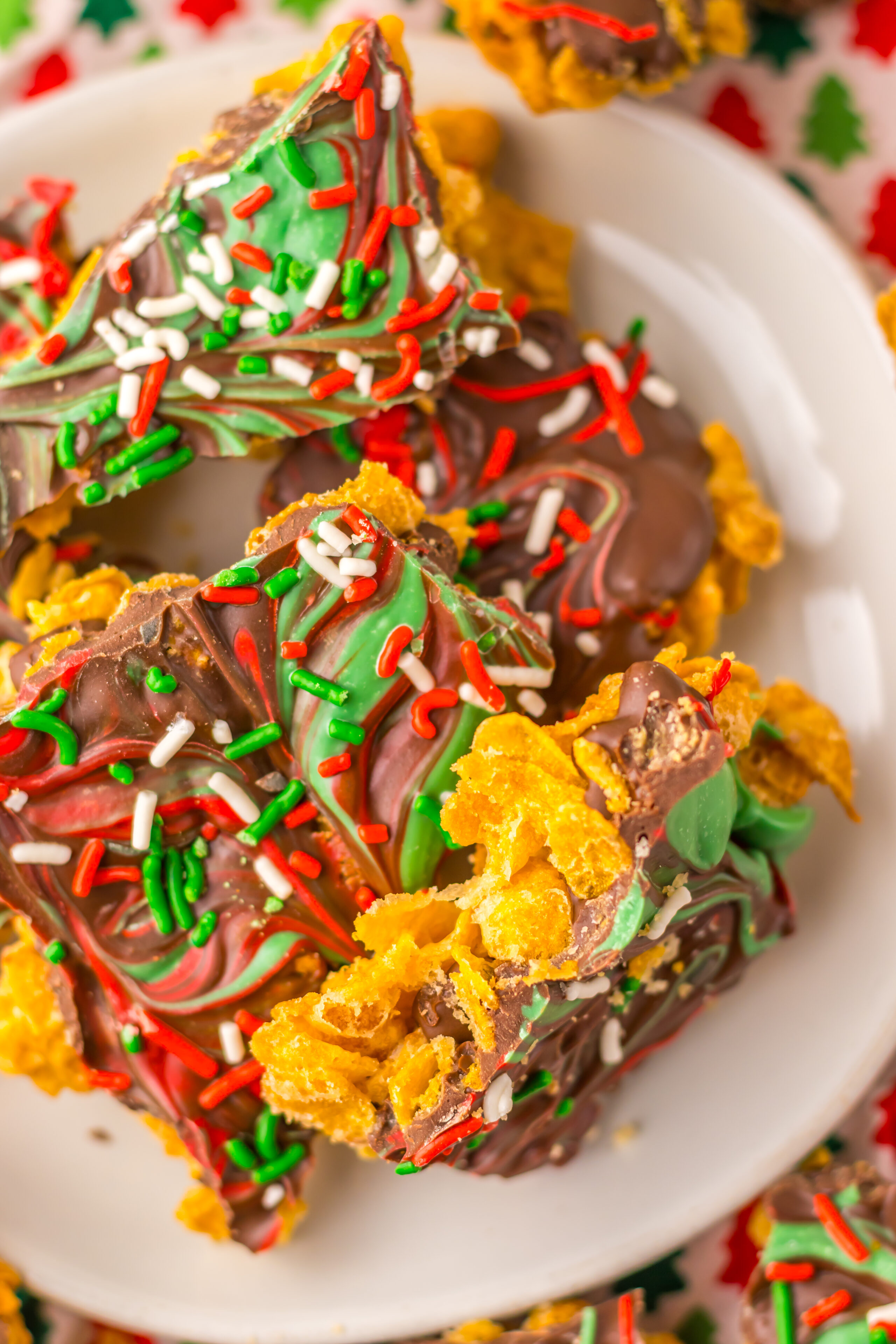 cornflake brittle on a white plate with Holiday colors.