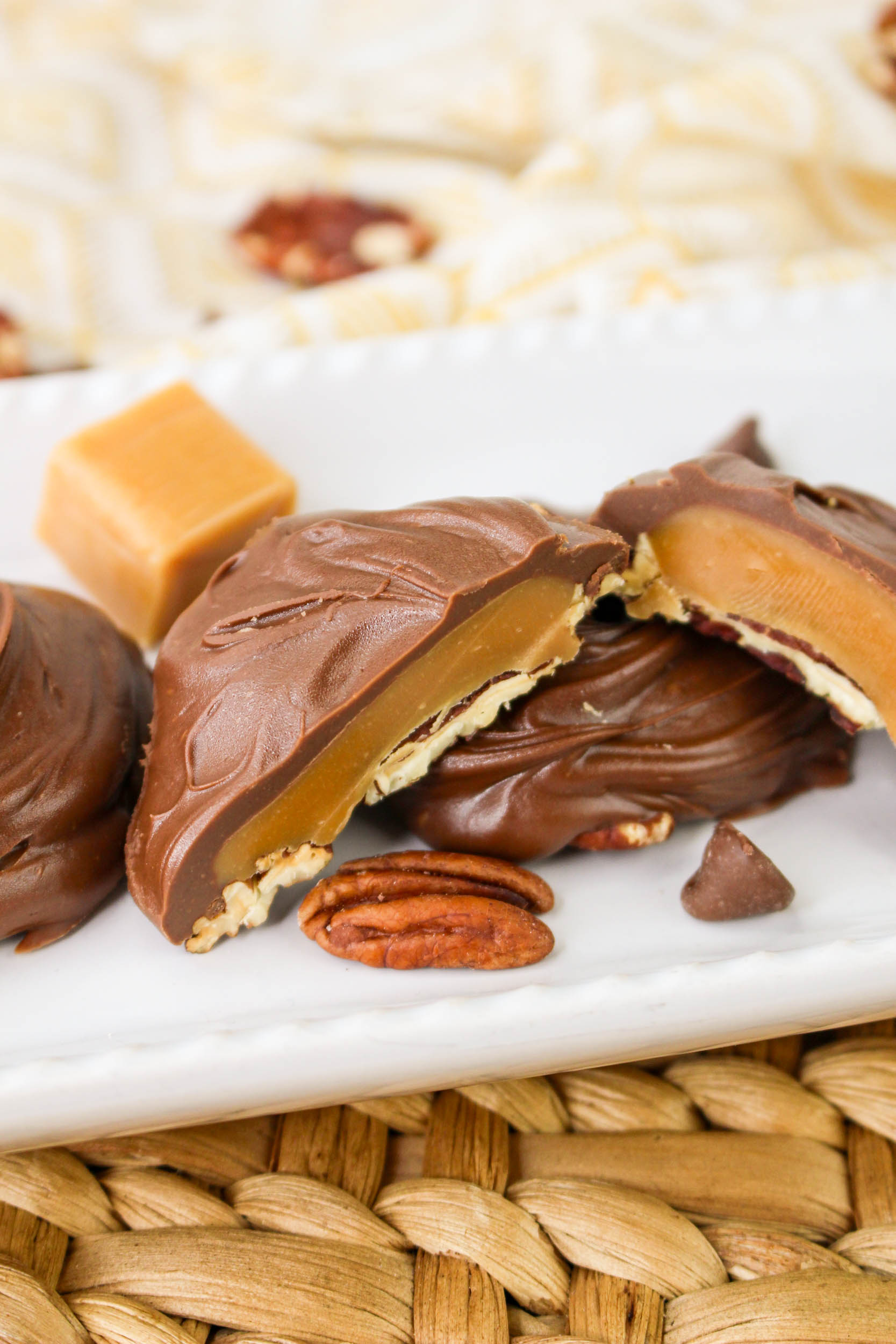 pecan caramel clusters on a white plate.