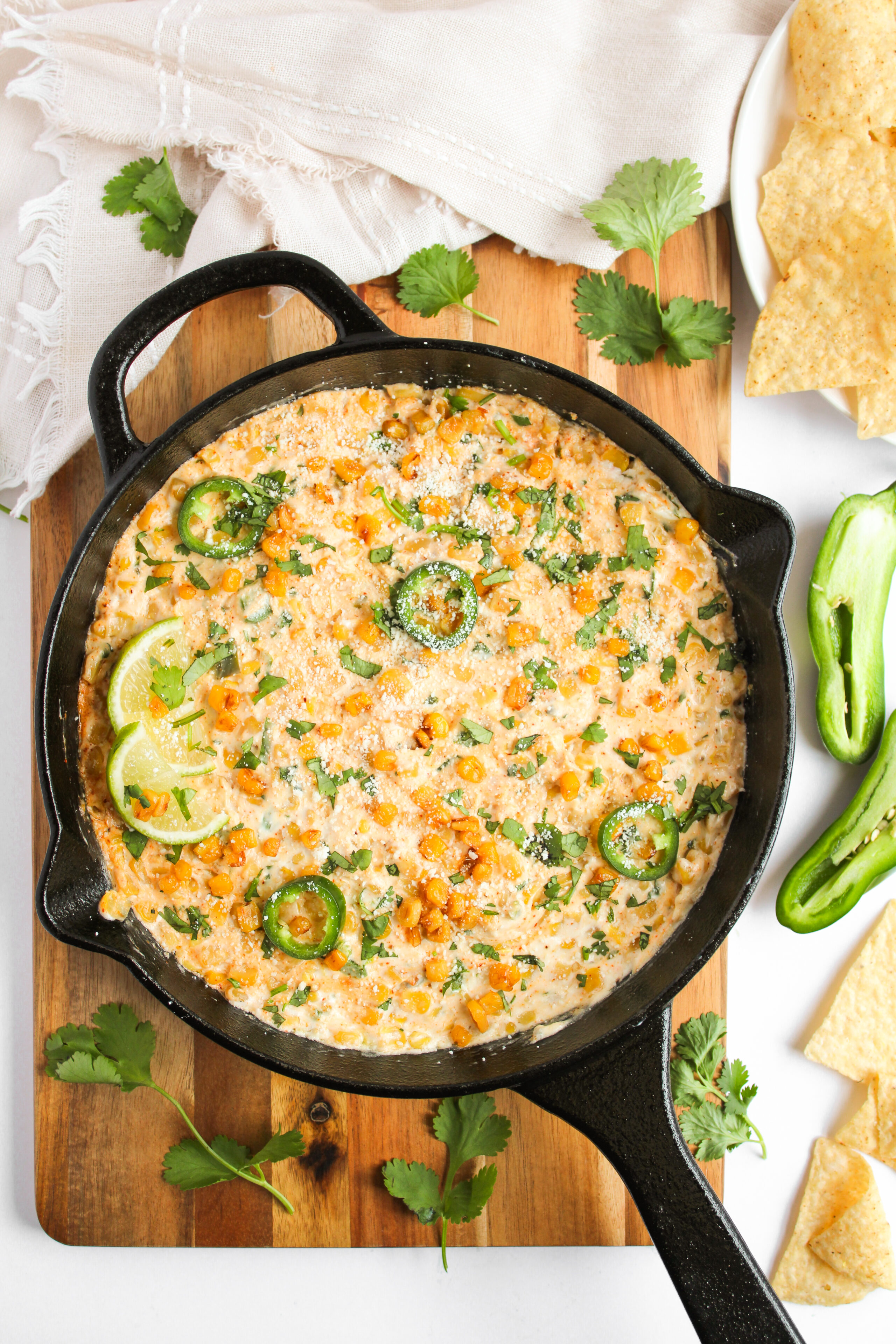 Mexican street corn dip in a cast iron skillet.