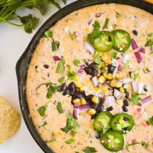 cheesy dip in a cast iron skillet.