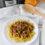 a hearty beef gravy with tips over noodles.