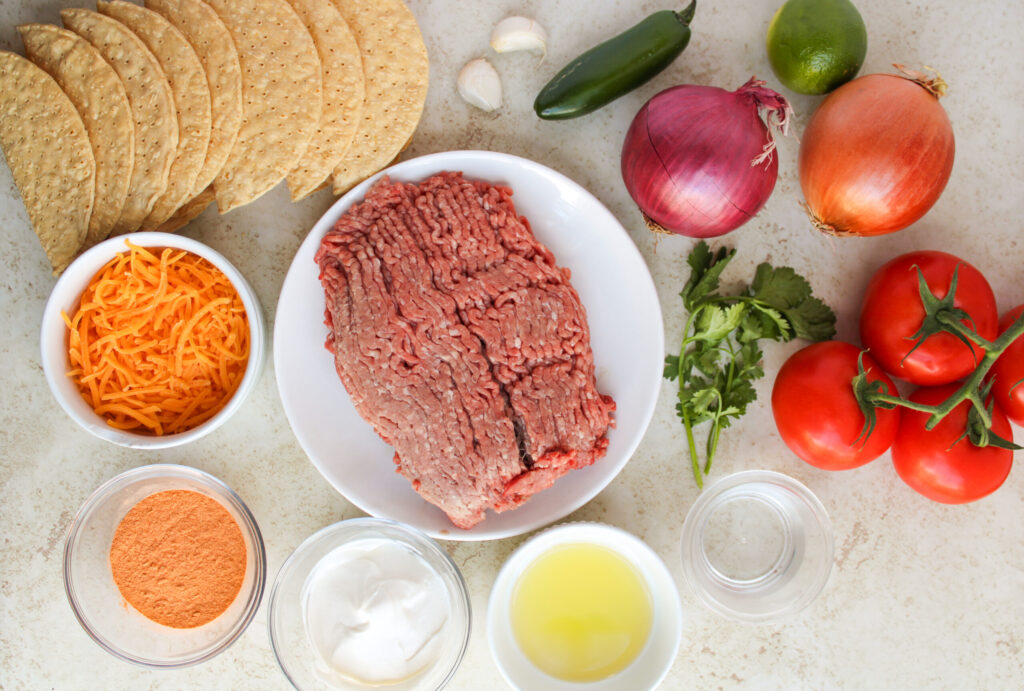 all the ingredients needed to make oven baked beef tacos.
