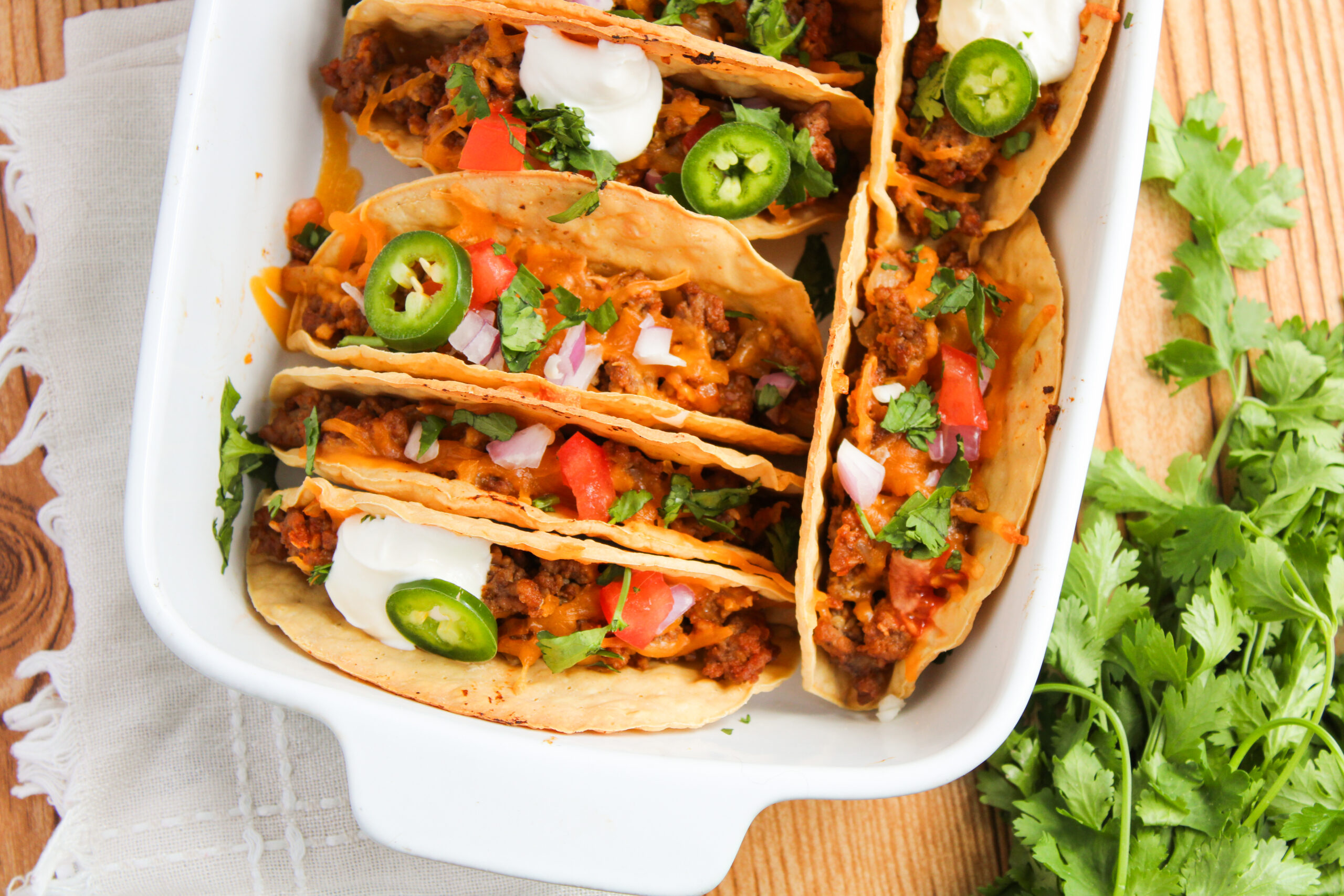 an oven baked Mexican dish in a white baking dish.