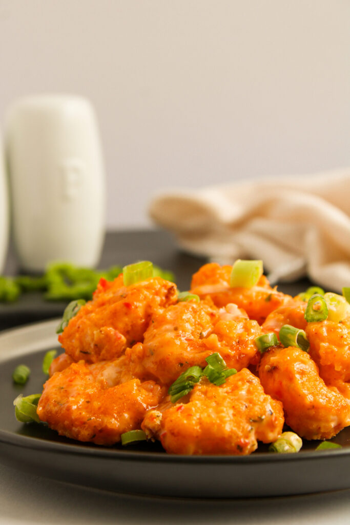 a Bonefish copycat bang bang shrimp recipe served on a black plate.