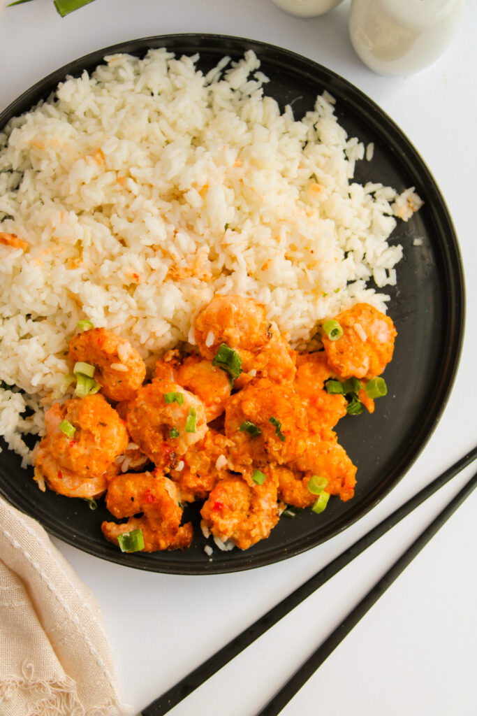 air fried shrimp served with rice on a plate.