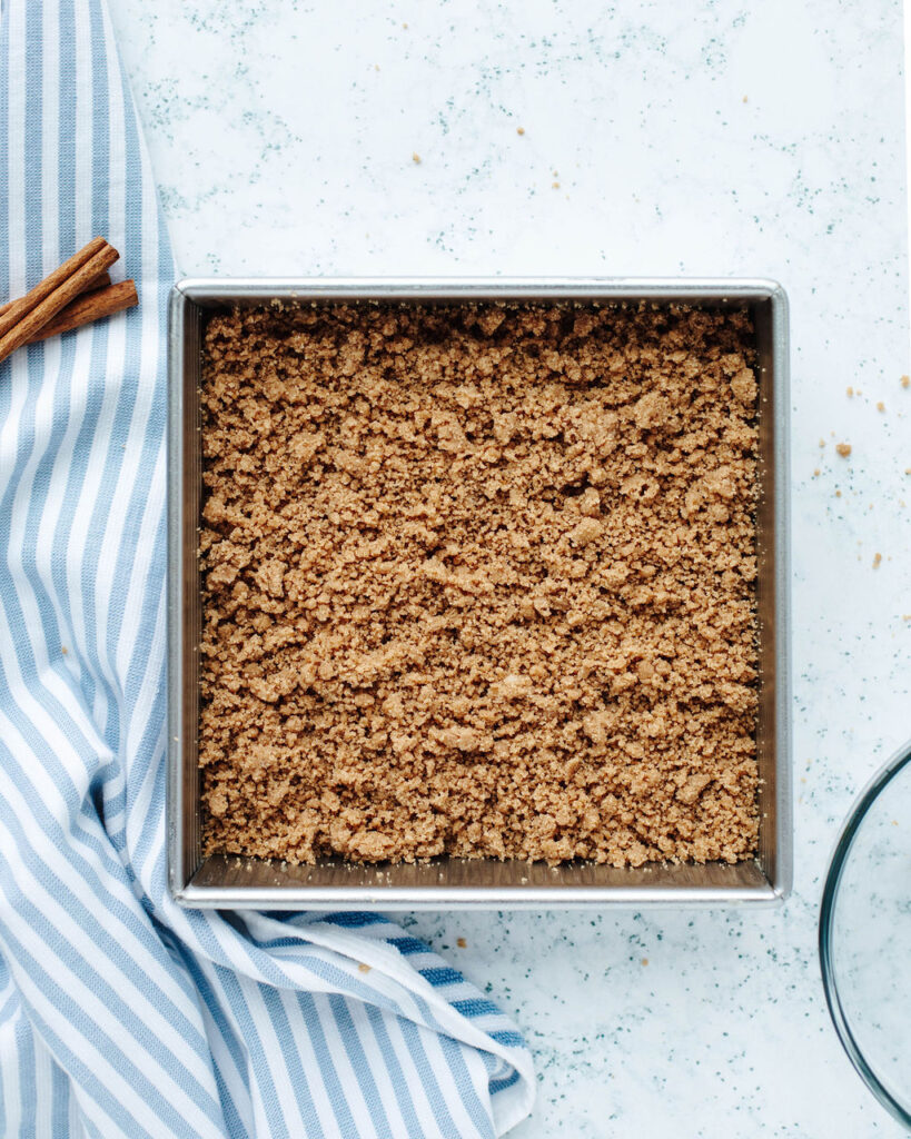 streusel topped coffee cake ready to be baked in the oven.