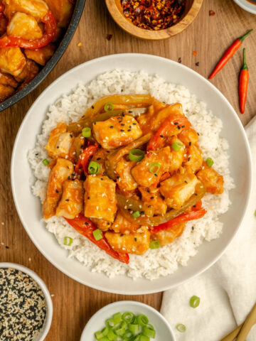 Angry Chicken served over white rice in a bowl.