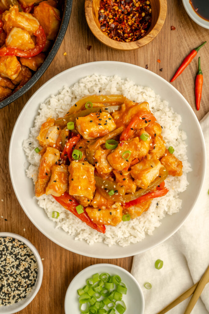 Angry Chicken served over white rice in a bowl.