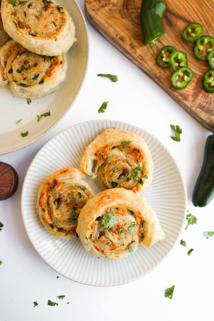 a white plate with a creamy puffy pastry appetizer ready to serve.