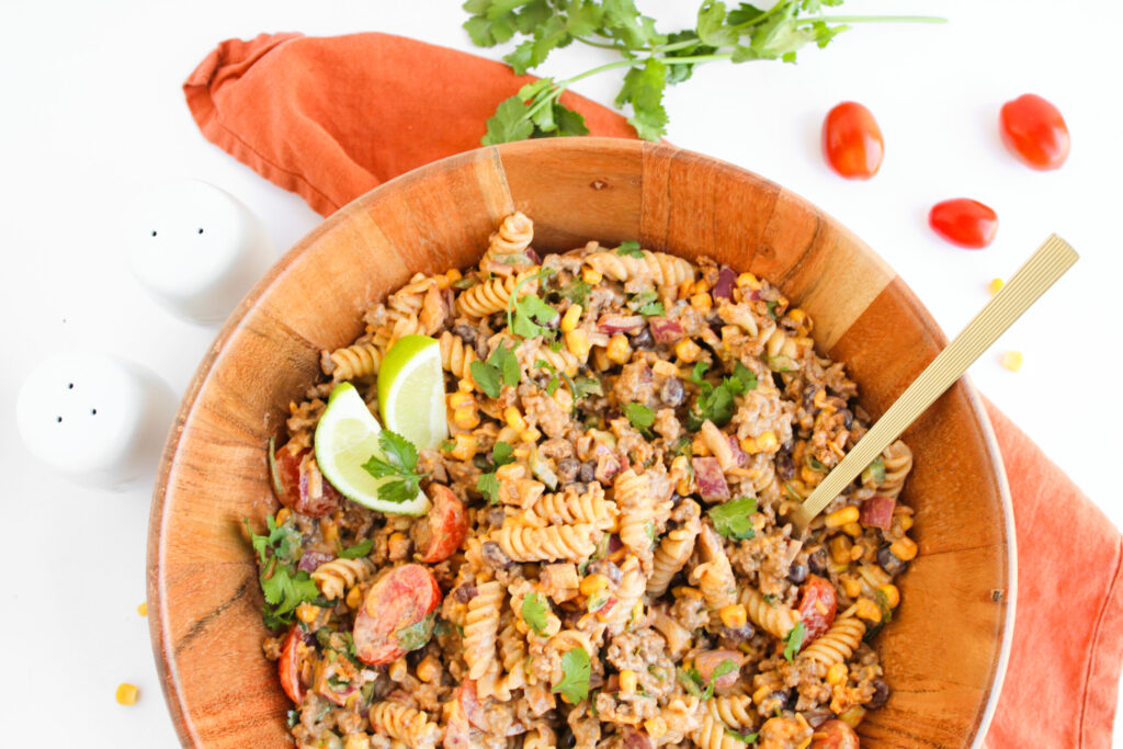 a protein packed pasta dish in a wood serving bowl.