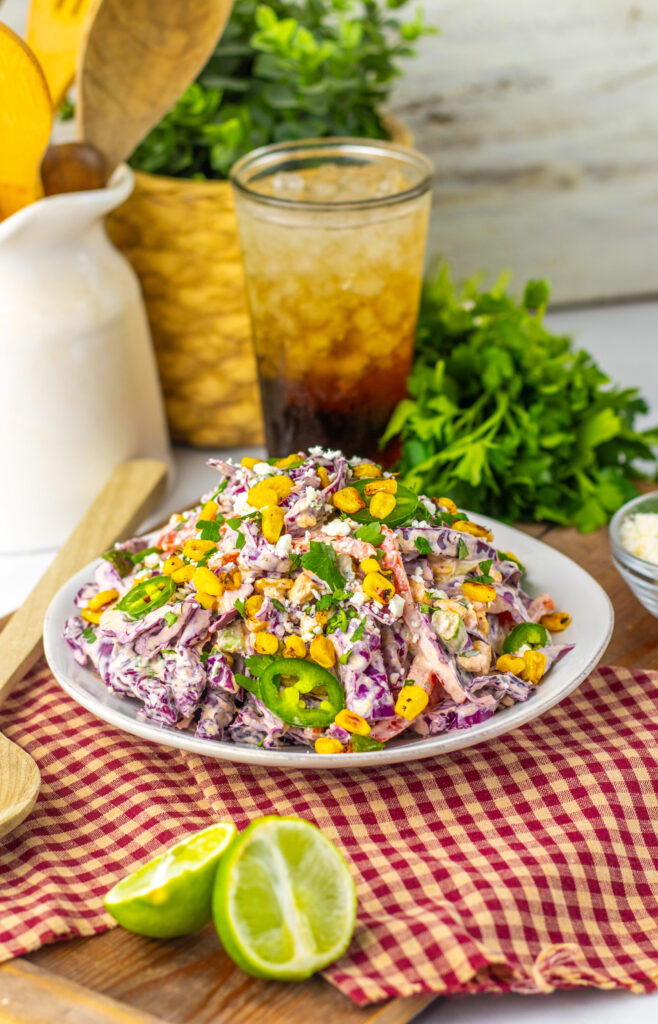 Mexican Street Corn Coleslaw in a white serving bowl.