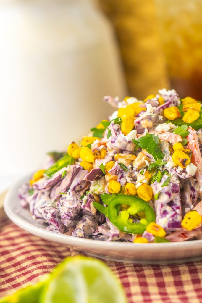 an up close look at a chili lime dressing coating on cabbage slaw.