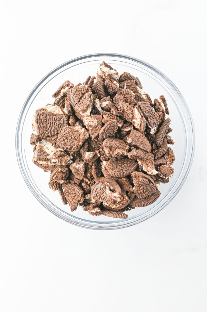 crushed Oreo cookies in a glass bowl.