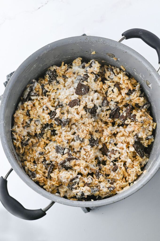 a pot with a mixture of Oreo Rice Krispie Treats ready to spread into a pan.