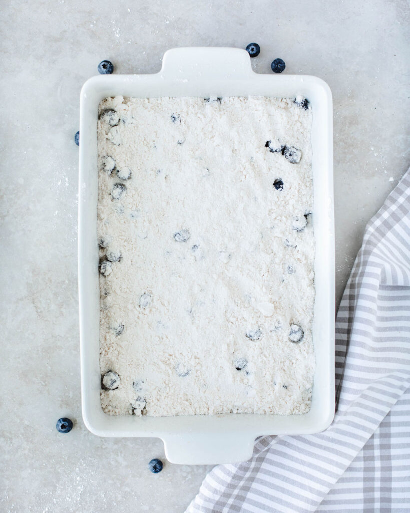 cake mix sprinkled on top of fresh blueberries.