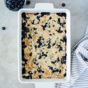 Blueberry Dump Cake in a white 9x13 baking dish.