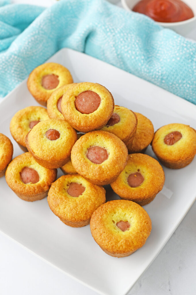 Mini Corn Dog Muffins on a white plate.